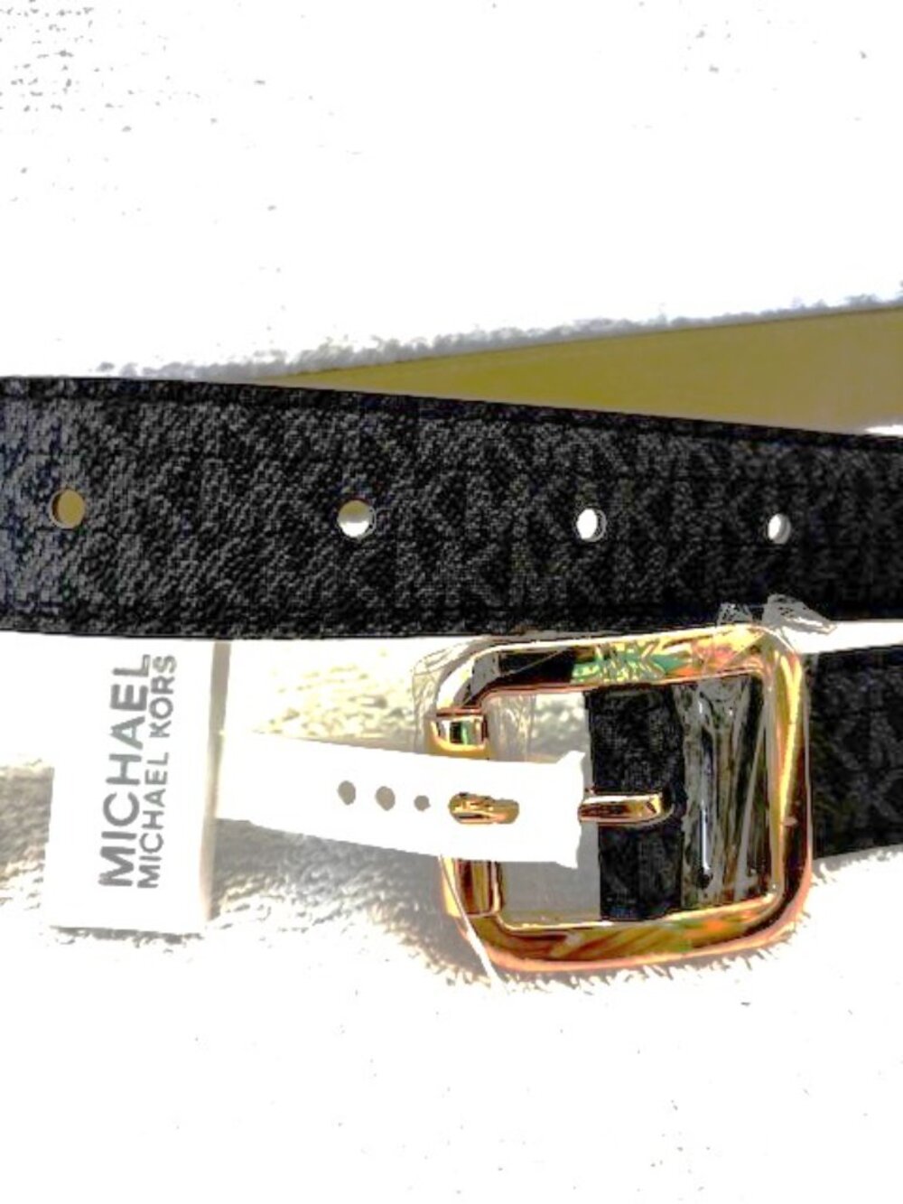 Michael Kors dark charcoal MK logo belt on black background NWT Size S